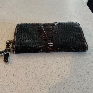 Beautiful shiny brown snakelike leather clutch or wallet